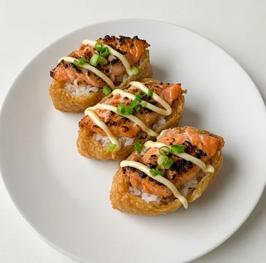 Aburi salmon pocket sushi, a tofu pouch of sushi rice topped with torched salmon, at Pocket Holic in Kensington, Calgary